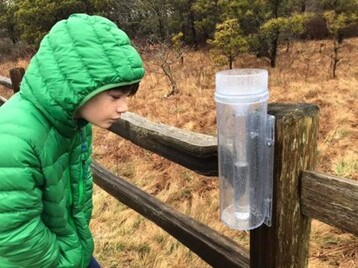 Charlie Bois measuring rain in 2021
